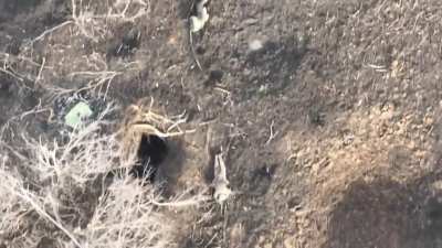 Russian soldier taken out by a dropped-grenade while attempting to shoot down the drone