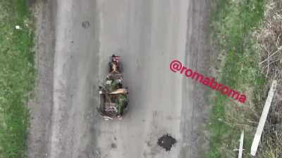UA POV Ukrainian drone drops a grenade straight into the back of a moving tractor/hauler