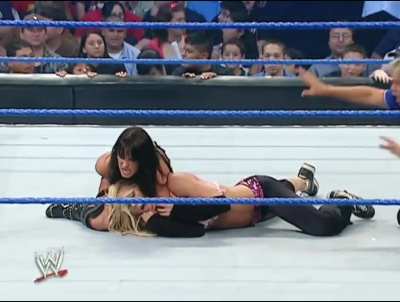 Victoria applies a long sleeperhold on Torrie Wilson as she talks shit to her. &ldquo;Come on Princess!&rdquo;