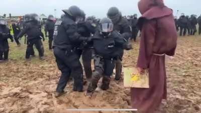 just some cops defending a coal mine stuck in mud. And a monk