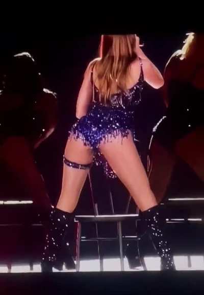 From behind