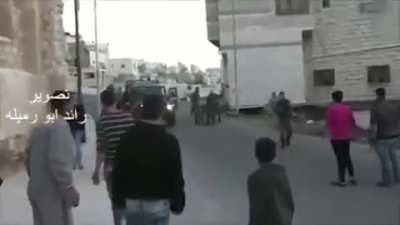Israeli soldiers throw crippled old man out of his wheelchair and start shooting at Palestinians who are trying to help injured. They are in no harm whatsoever. Israel cannot hide anymore people see you for the cowards you really are