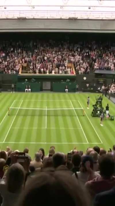The Center Court crowd rises for eight-time Wimbledon Champion Roger Federer