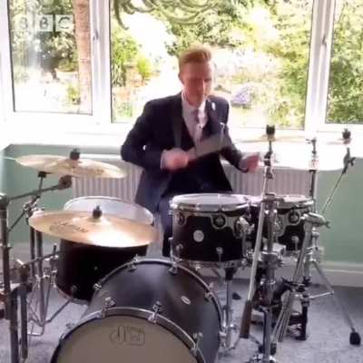 Weatherman drums the BBC theme song on live TV