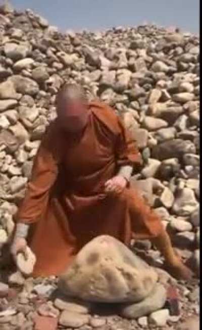 Monk breaks rocks with fingers