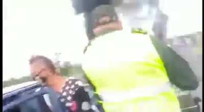 Stealing petrol from an overturned tanker.