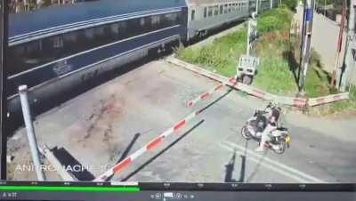 Old lady ignores crossing barriers