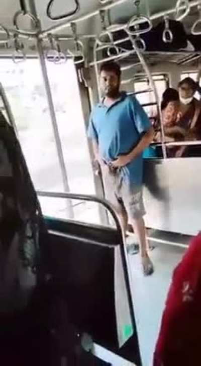 Dude in India rubbing one out between women on public transport.