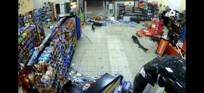 Car crashes into gas station 