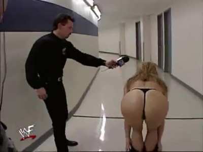 Tori (Terri Poch) takes off her gown before her Evening Gown Match with Ivory, "WWF SmackDown," Kemper Arena, Kansas City, MO, August 26, 1999 (taped August 24)