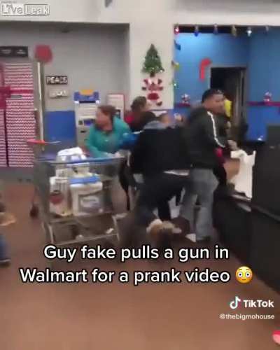 Guy pulls a fake gun in Walmart for a &acirc;Prank&acirc; video.