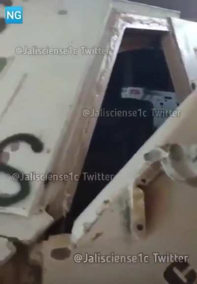 Michoacán; CJNG next to their monstruo, looks like it has some heavy use;