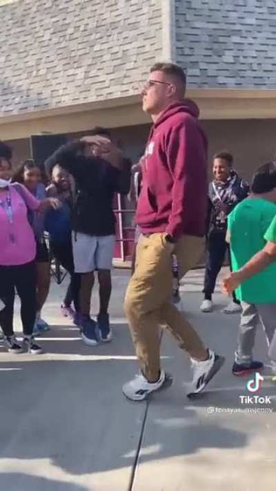 Students go crazy after a teacher shows off his moves