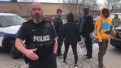 Canadian anti-masker speaking in tongues, freaks out at man filming her while an officer watches