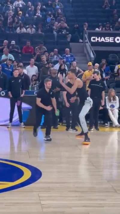 7&rsquo;4&rdquo; NBA rookie Victor Wembanyama with an 8&rsquo; wingspan warming up with his trainer