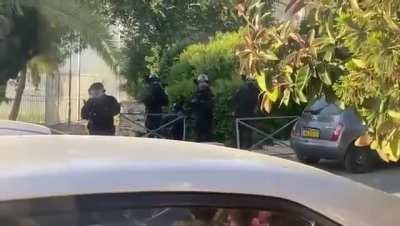 An Israeli soldier shooting shooting at a Palestinian in her home in Sheikh Jarrah