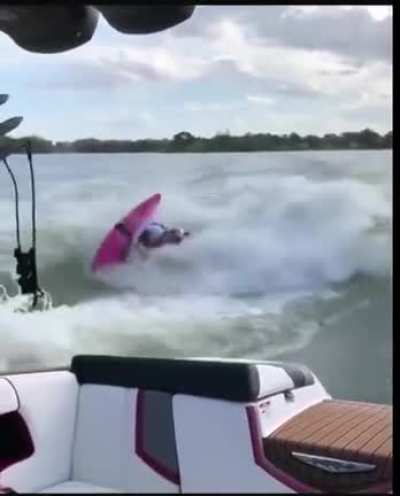 Kayaking in a boat's wake
