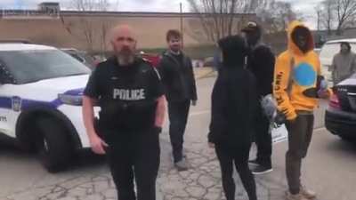 Canadian anti masker speaking in tongues, freaks out at man filming her while an officer watches.
