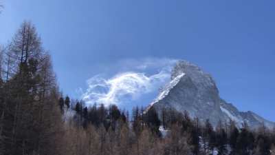 Strong winds blow snow of the Matterhorn