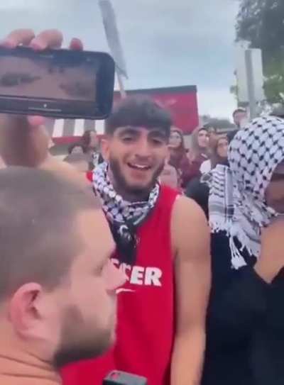 Muslims show the bodies of Israeli civilians massacred by Hamas Islamic terrorists while laughing hysterically. "Look, that's your boy" one of them screams.