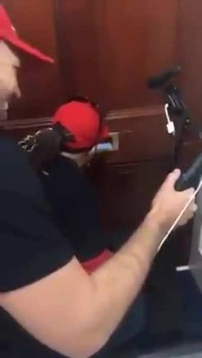 Video from 2019 of current sitting congresswoman Marjorie Taylor Greene harassing AOC's office through a mail slot and telling the office to open the door and come out.