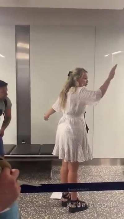 Guy shoves his girlfriend and then attacks an airport worker.