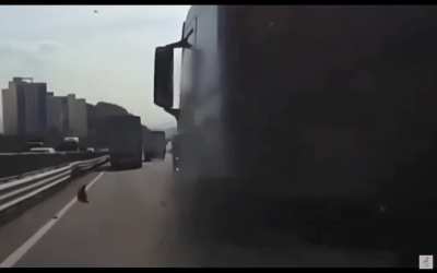 Truck flips over car