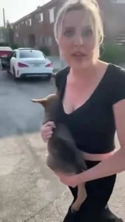 Crazy white woman throws puppy at a guy