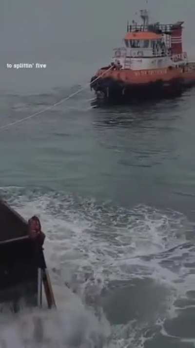 Coal barge in rough seas