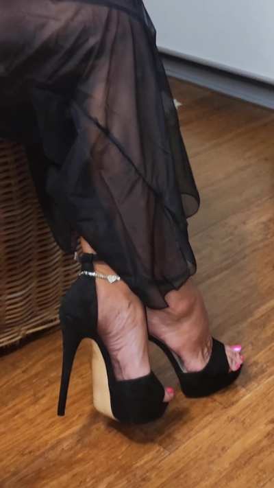 Black stilettos and sheer black pants &mdash; the perfect conspiracy of power and temptation. Every step whispers authority, every glance dares desire to follow