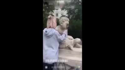 POS records herself destroying a sculpture and posts it on her instagram