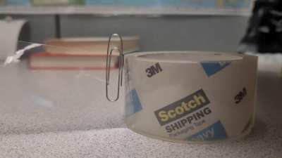 Paperclip on packaging tape. MIC DROP.