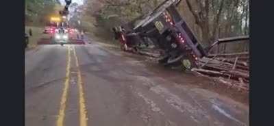 Tow-truck driver righting an overturned logging truck gets a surprise