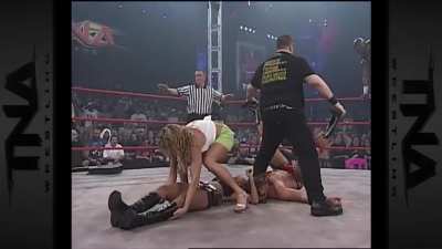 Gail Kim low blowed from the turnbuckle