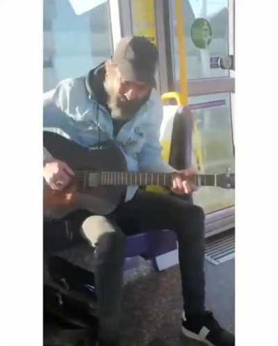 Busker singing you've got a friend to an autistic child on the luas &hearts;