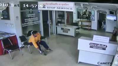 Dude sitting a lobby gets attacked by a snake