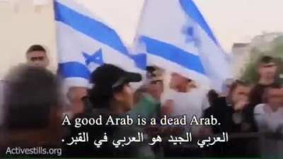 Israeli settlers openly raising racist slogans towards Palestinians and calling for an apartheid.