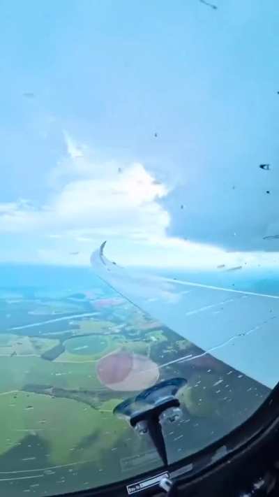 A compilation of aerial views showing rain, lightning, and powerful thunderstorms.