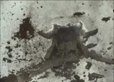 A Ukrainian FPV drone hits a Russian dugout. Four dazed Russian soldiers stumble out, some of them wounded.