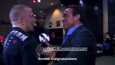 After a grueling 25 min fight, UFC fighter George St. Pierre meets his idol Arnold Schwarzenegger
