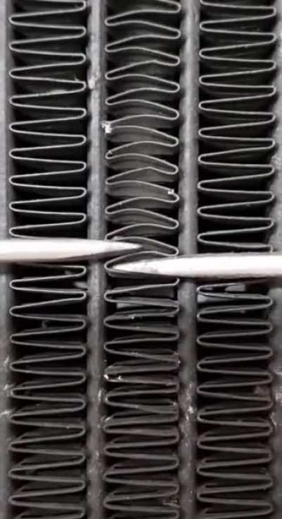 Fixing a motorcycle radiator.