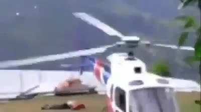 Man walks into helicopter blade