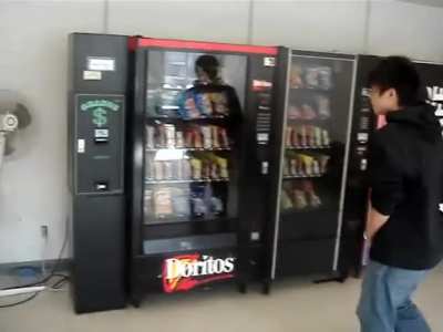 Kid breaks vending machine while trying to get a free snack
