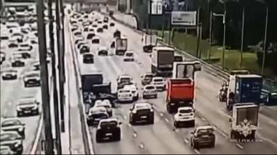 Rear wheel breaks off a car on a busy road and causes quite a pileup
