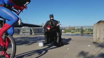 Batman playing uke.