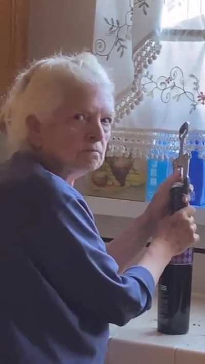 HMC granny opening the wine