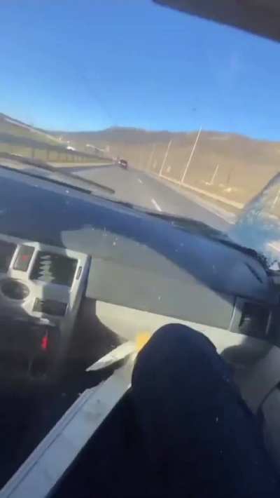 Main character reckless driver hits his car behind a truck.