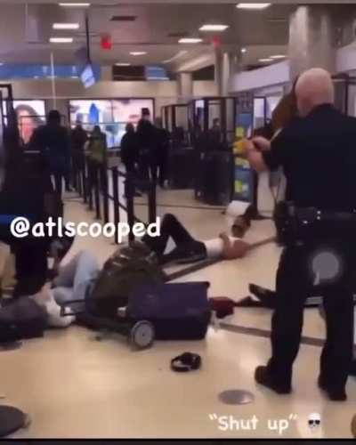 2 Guys freak out at ATL Airport and begin attacking a group of people, they both get tased by a TSA Officer