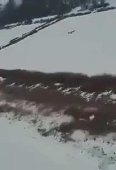 Footage of an Iranian/Russian "Shahed" UAV getting shot down with a machine gun by a Ukrainian helicopter crew.