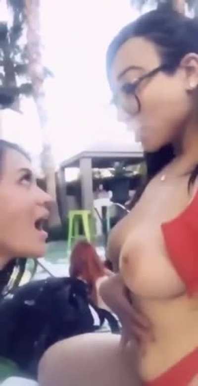 Friends Enjoying Each Other's Company At A Pool Party